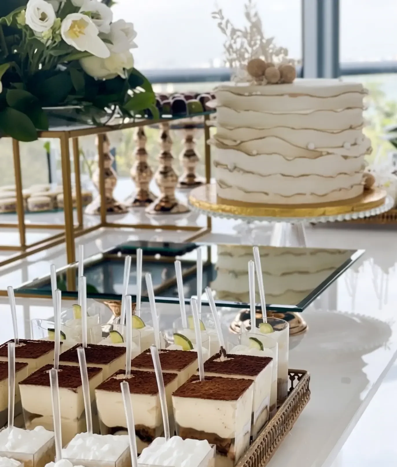 Elegant dessert table with tiramisu shots and key lime cups Miami